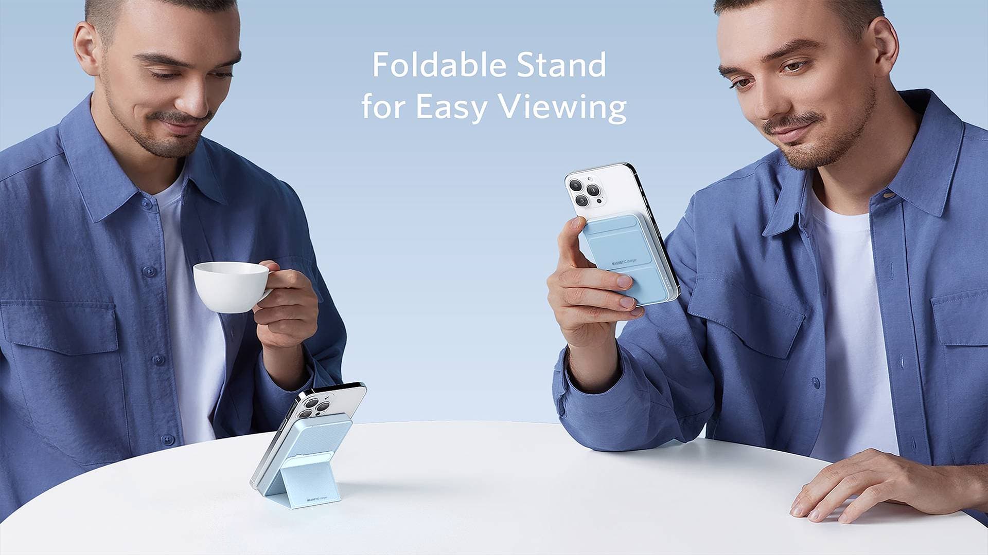 Man using light blue magnetic power bank with foldable stand to prop up his smartphone.